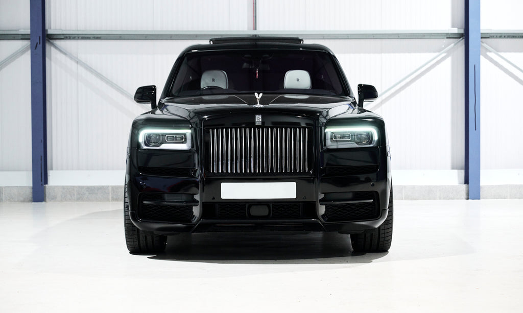 Black luxury SUV in a garage setting