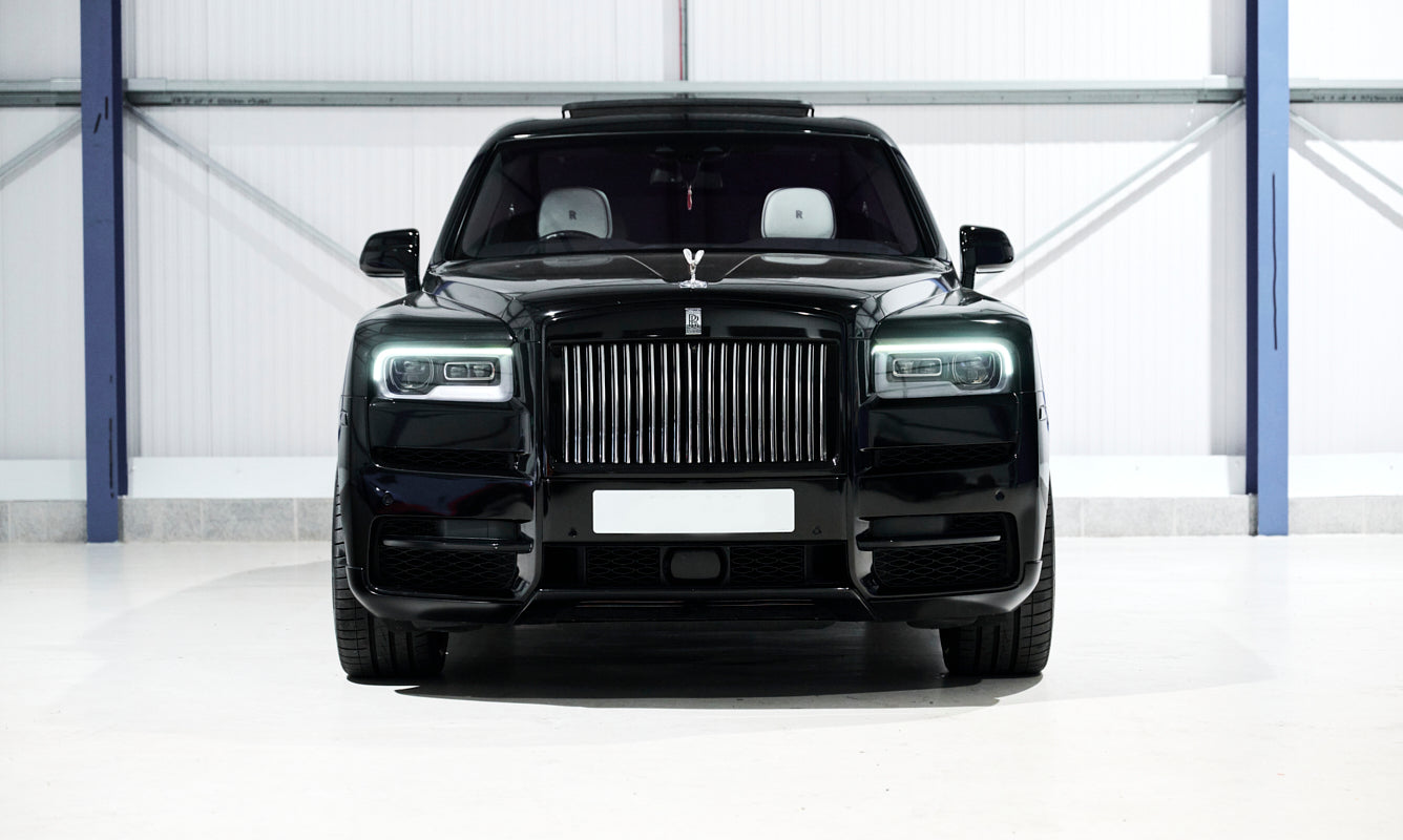Black luxury SUV in a garage setting